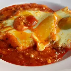Baked Tomatoes with Eggs and White Cheese