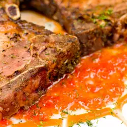 Steaks with Sauce and Tomatoes