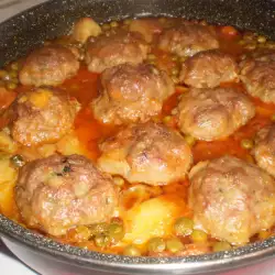 Meatballs with Peas and Potatoes in the Oven