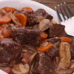 Shank with Potatoes and Mushrooms in the Oven