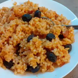 Rice on the stove with olives