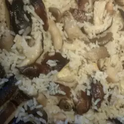 Rice on the stove with mushrooms