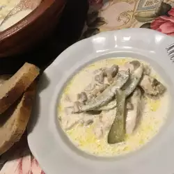 Chicken with Pickles and Mushrooms in a Ceramic Dish