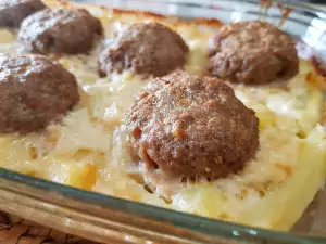 Baked Meatballs with Potatoes, Cream and Processed Cheese