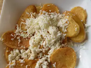 French Fries Cooked in Butter and with Feta Cheese on Top