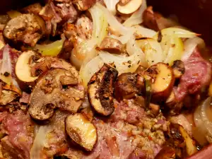 Pork Neck with Onions and Mushrooms in a Guvec