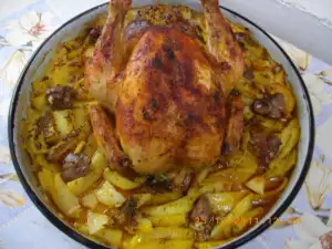 Chicken on a Beer Bottle with Potatoes