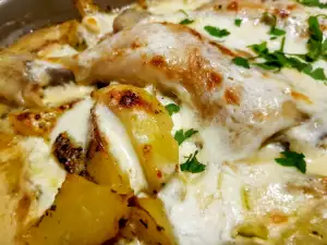 Chicken with Cream and Potatoes in a Glass Cook Pot