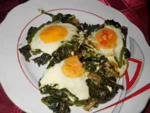 Eggs Sunny Side Up on a Bed of Dock and Spinach