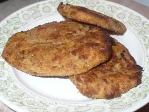 Crunchy Schnitzels with Potatoes and Mince in the Oven