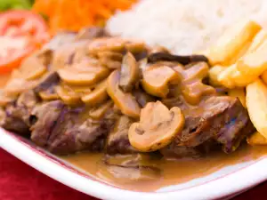 Steaks with Mushroom Sauce and Wine in the Oven