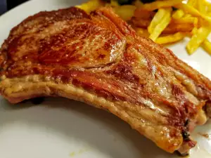 Beef Steaks with Butter on a Cast Iron Pan