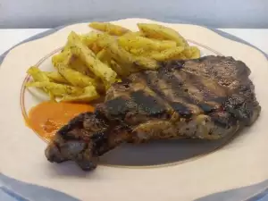 Pork Neck Steaks with Chili Sauce and Fries