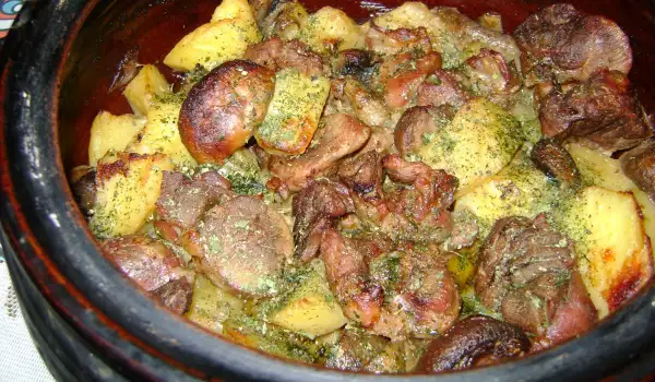 Shank with Potatoes and Mushrooms in a Clay Pot