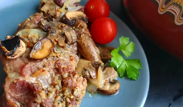 Pork Neck with Onions and Mushrooms in a Guvec