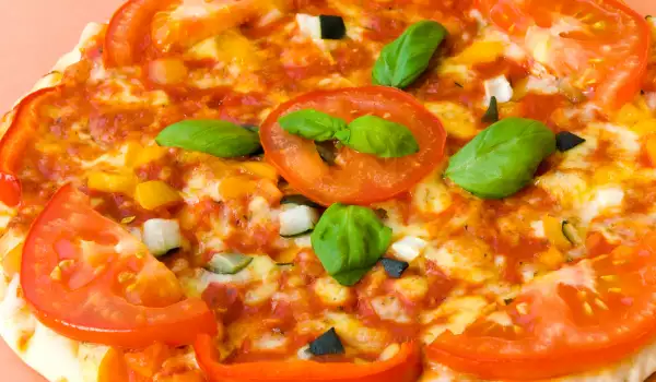 Homemade Pizza with Tomatoes and Cheese