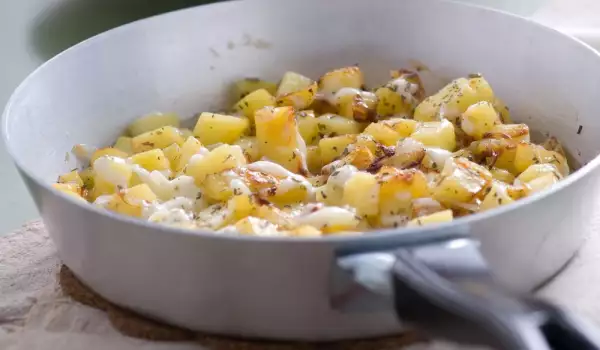 Potatoes with Cheese in a Pan
