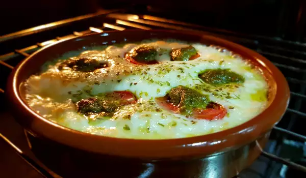 Oven-Baked Provolone Cheese with Cherry Tomatoes and Pesto