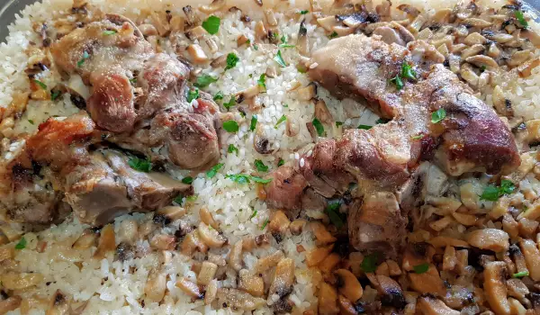 Oven-Baked Pork Shank with Rice and Mushrooms