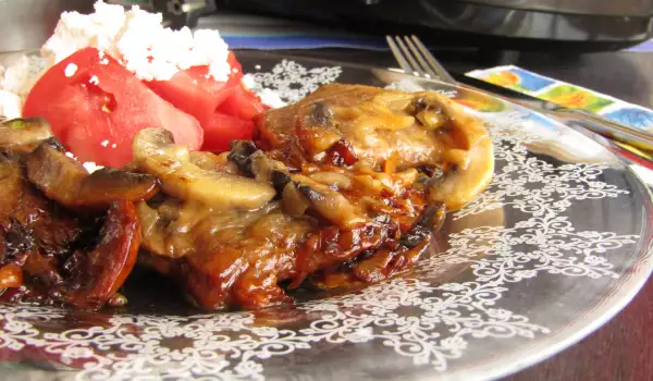 Veal Steaks with Mushrooms and Sauce in the Multicooker