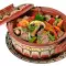 Clay pot dish with mushrooms and hot peppers