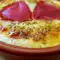 Oven-Baked Yellow Cheese with a Red Pepper