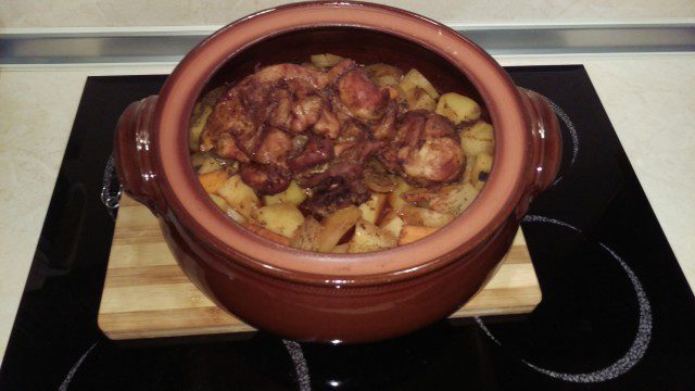 Tasty Pork Shank with Potatoes in a Clay Pot