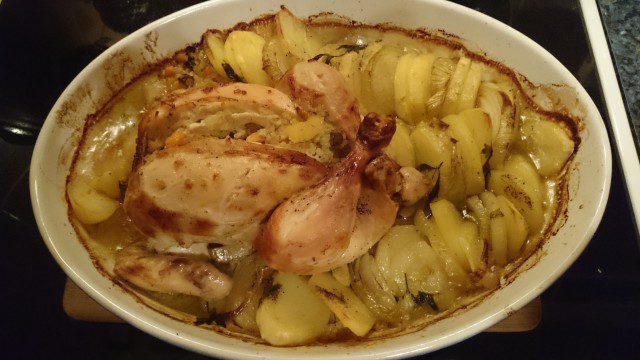 Chicken Stuffed with Rice and Garnished with Potatoes