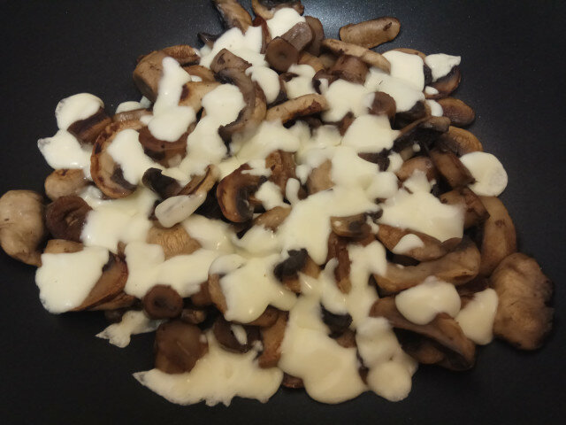 Royal Field Mushrooms with Butter and Yellow Cheese